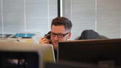 A call center agent leveraging his understanding of enterprise contact center solutions to one of their clients.